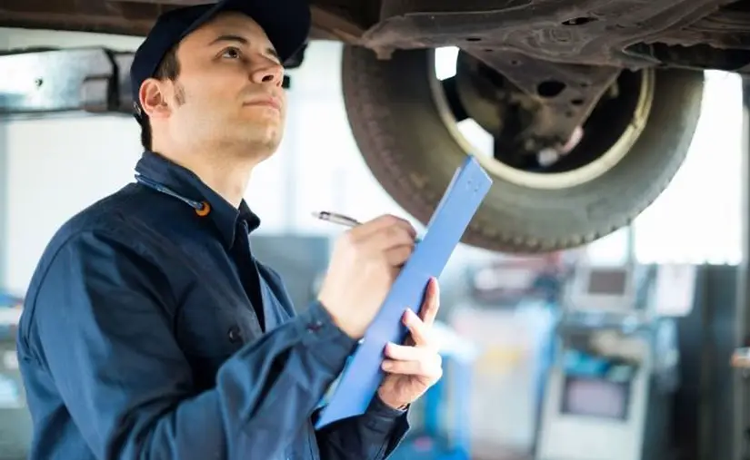 Man doing maintenance on a car